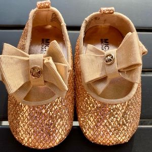 Shiny gold Michael Kors baby slippers